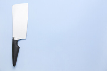 Meat cleaver on color background, top view