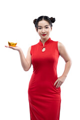 Asian Chinese woman in a cheongsam dress holding a Chinese gold ingot