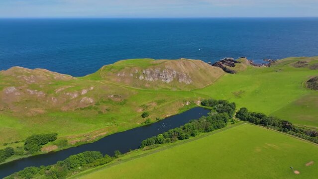 St. Abbs Head coastal cliffs and Mire Loch aerial view in summer near village of St. Abbs, Berwickshire, Scotland, UK. 