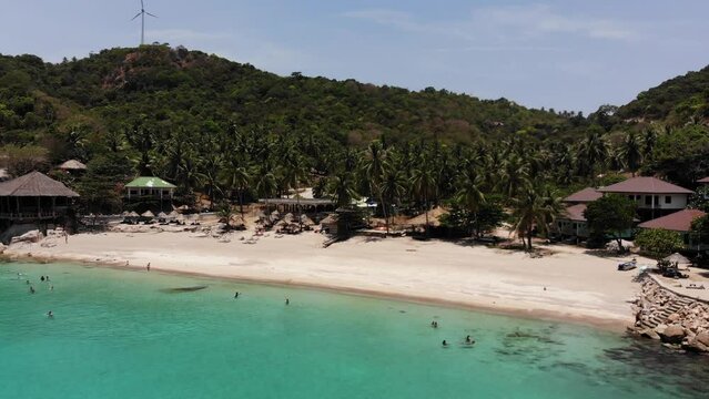 Zoom in at wonderful Aew Leuk Beach at Koh Tao in Thailand, filmed with a Drone.