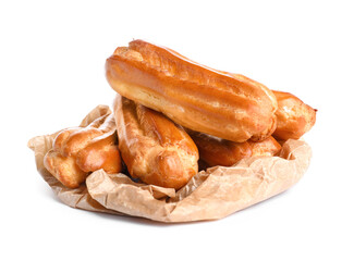 Baking paper with sweet eclairs on white background