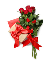 Red roses with gift and envelope on white background. Valentine's Day celebration