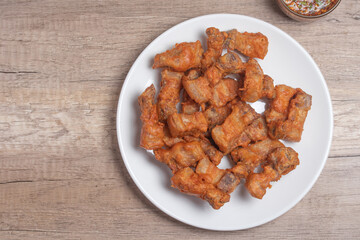Deep fried pork belly with fish sauce and spicy dipping sauce