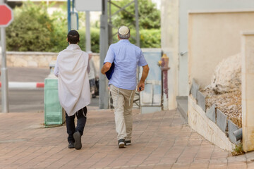 Two men go to the synagogue on Shabbat