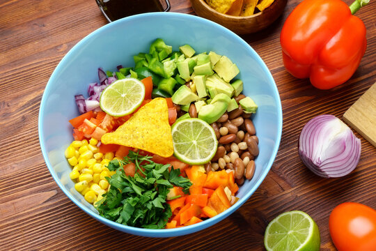 Salad texas caviar. Vegetable dish with corn, beans, pepper, pepper, tomatoes, beans. Served with corn chips nachos