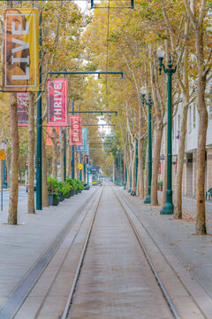 SAN JOSE, CALIFORNIA - CIRCA OCTOBER, 2021: Valley Transport Authority light rail track on the road in the city