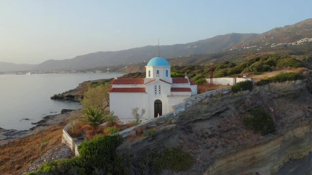 4k drone flight point of view (Ultra High Definition) of Agia Paraskevi Church. Beautiful morning scene of Peloponnese peninsula, Greece, Europe. Wonderful summer seascape of Ionian sea..