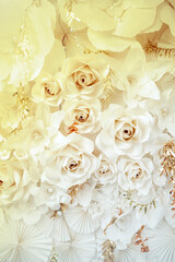 Decorative background with paper flowers with a touch of gold. vertically.