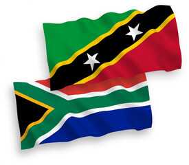 National vector fabric wave flags of Federation of Saint Christopher and Nevis and Republic of South Africa isolated on white background. 1 to 2 proportion.