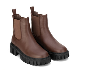 Brown women's leather shoes on a white background. Fashion trend. Winter season half-boots.