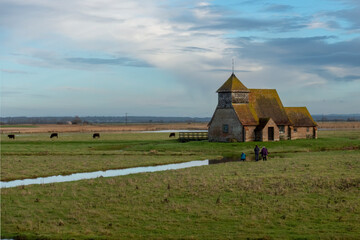 Three ladies photographing the Thomas a Becket Church