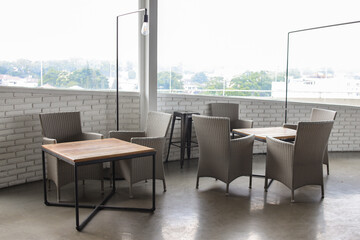 Industrial dining table set at roof top restaurant with city view