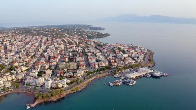 4k drone forward video (Ultra High Definition) of Chalcis town. Stunning morning seascape of Aegean sea, North Euboean Gulf. Impressive summer scene of Euboea island, Greece, Europe.