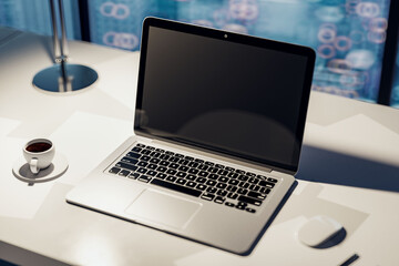 Perspective view on blank black modern laptop monitor with place for your logo or text on light work table with coffee cup and evening city view background, closeup. 3D rendering, mock up