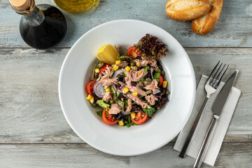Tuna salad in a white porcelain bowl. Healthy food concept