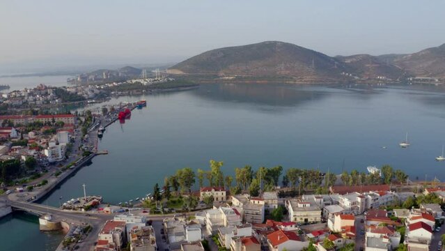 4K aerial - a bird's eye view&nbsp;video (Ultra High Definition) of Chalcis town with Chalkida's Old Bridge, Greece, Europe. Spectacular summer view of Euboea island, Greece, Europe.