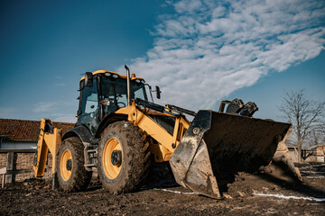 Low angle view of an earthmover on construction site.