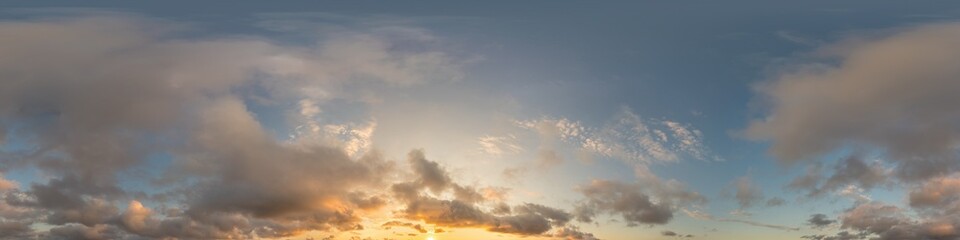 Dark blue sunset sky panorama with golden Cumulus clouds. Seamless hdr 360 panorama in spherical equirectangular format. Full zenith for 3D visualization, sky replacement for aerial drone panoramas.
