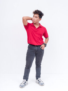 A confident filipino man with curly hair wearing a red polo shirt and blue jeans. Full body photo, isolated on a white background.