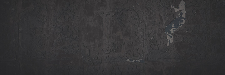 Fototapeta premium Dark wide panoramic background. Faded rough wall texture with pieces of glue and stucco in place of old tile. Blank vintage background for design. Shaded texture with vignette.