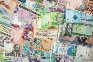background of different banknotes of African notes that are spread all over the table.