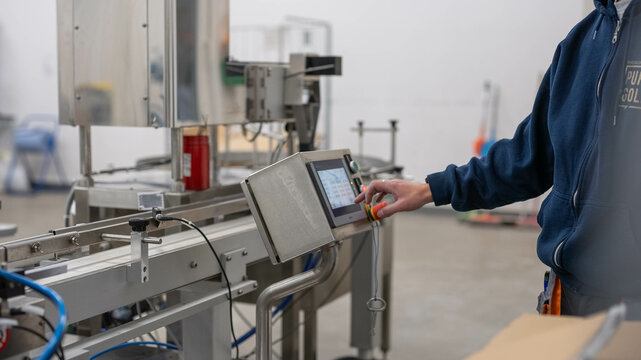 Factory worker man programming closeup