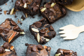 Small sweet topping with chocolate chips and slice almonds. Close up
