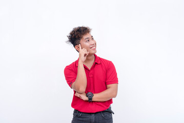 An optimistic young man thinking while looking at the right. Visualizing happiness. Isolated on a white background.