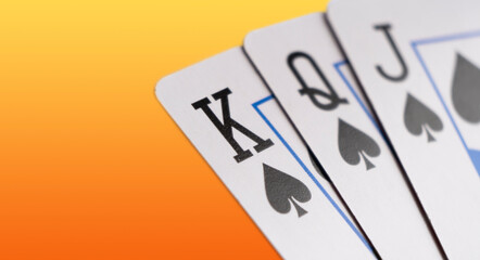 Playing cards isolated on color background. Hand of playing clubs cards isolated.