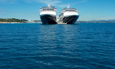 Two blue luxurious holiday vacation ocean cruise liner ships in port
