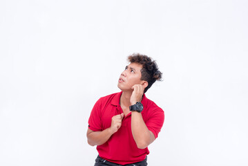 A bewildered man cowers and looks to his upper left with fear and anxiety. Isolated on a white background.