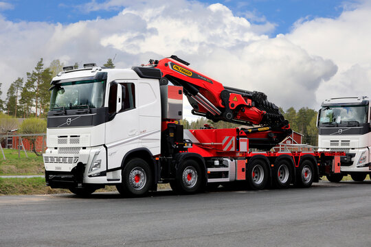 New White Volvo FH Boom Truck with Palfinger Crane Parked on a Yard. 