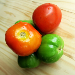Fresh tomatoes isolated on board
