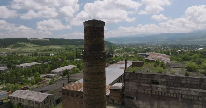 Ruined Chimney Of An Industrial Building In Khashuri, Georgia. aerial ascend