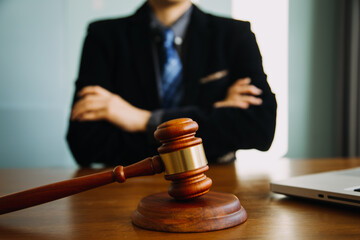 Business and lawyers discussing contract papers with brass scale on desk in office. Law, legal...
