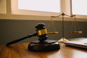 Business and lawyers discussing contract papers with brass scale on desk in office. Law, legal...