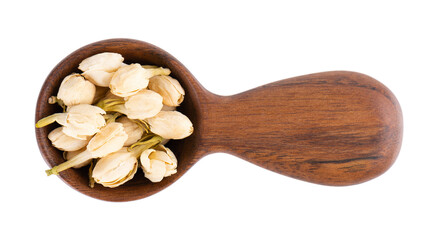 Dry jasmine flowers in wooden spoon, isolated on white background. Jasmine flowers tea. Herbal tea....