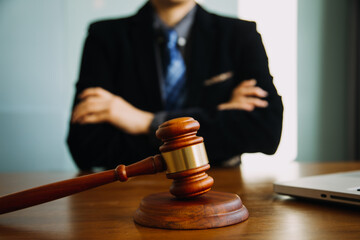 Business and lawyers discussing contract papers with brass scale on desk in office. Law, legal...