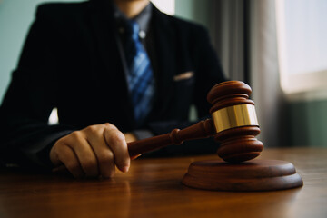 Business and lawyers discussing contract papers with brass scale on desk in office. Law, legal...