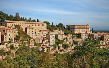 Fototapeta na wymiar Caprarola, Viterbo, Lazio, Italy: landscape of the old town with the ancient buildings Villa Farnese and the former stables