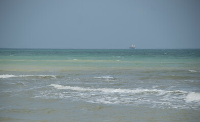 Sea view. There are boats in the distance.