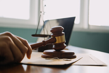 Business and lawyers discussing contract papers with brass scale on desk in office. Law, legal...
