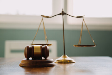Business and lawyers discussing contract papers with brass scale on desk in office. Law, legal...