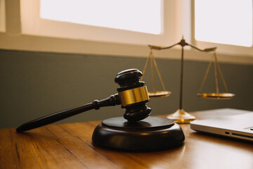 Business and lawyers discussing contract papers with brass scale on desk in office. Law, legal...