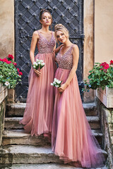 Beautiful bridesmaids in gorgeous elegant stylish red pink violet floor length v neck chiffon gown...