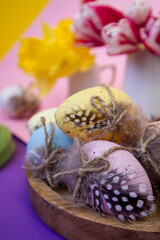 Decorated Easter eggs on a multi-colored background close up