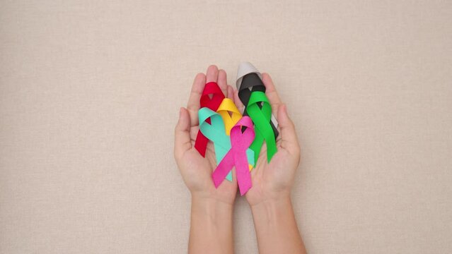 World cancer day, February 4. Colorful ribbons for supporting people living and illness. Healthcare, fighting, medical and National Cancer Survival day, Autism awareness day concept