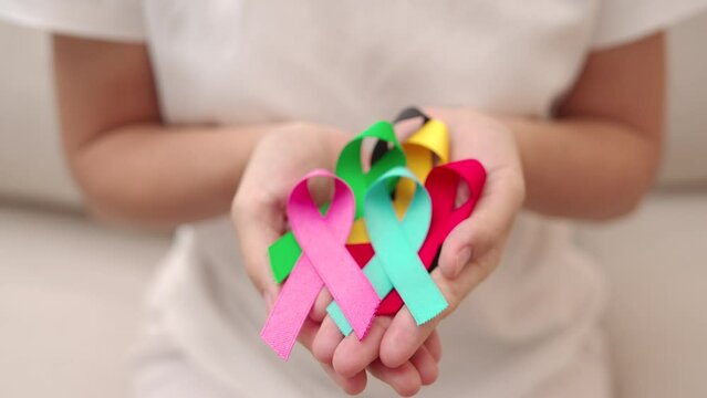 World cancer day, February 4. Colorful ribbons for supporting people living and illness. Healthcare, fighting, medical and National Cancer Survival day, Autism awareness day concept