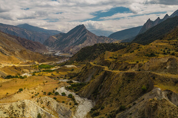 Changeable weather in the Caucasus Mountains. Panoramic view.