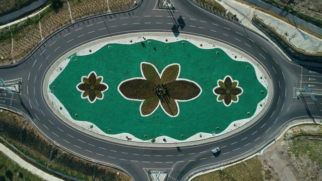 Drone bird's eye view of intersection with floral pattern